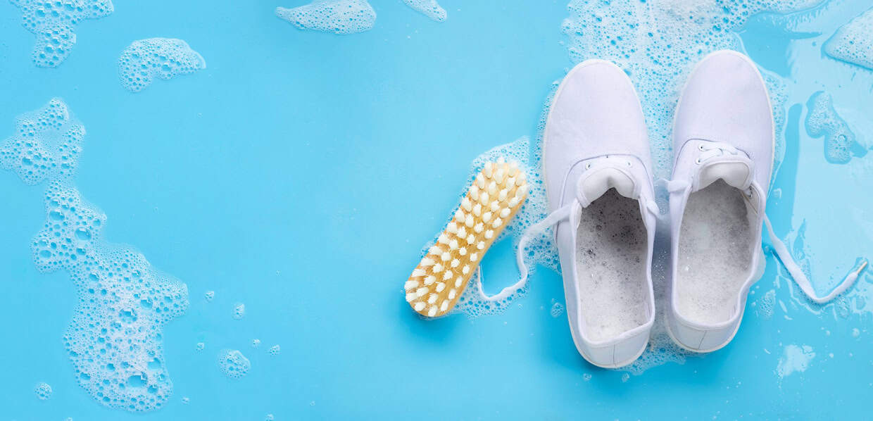 cleaning sneakers on blue background depositphotos
