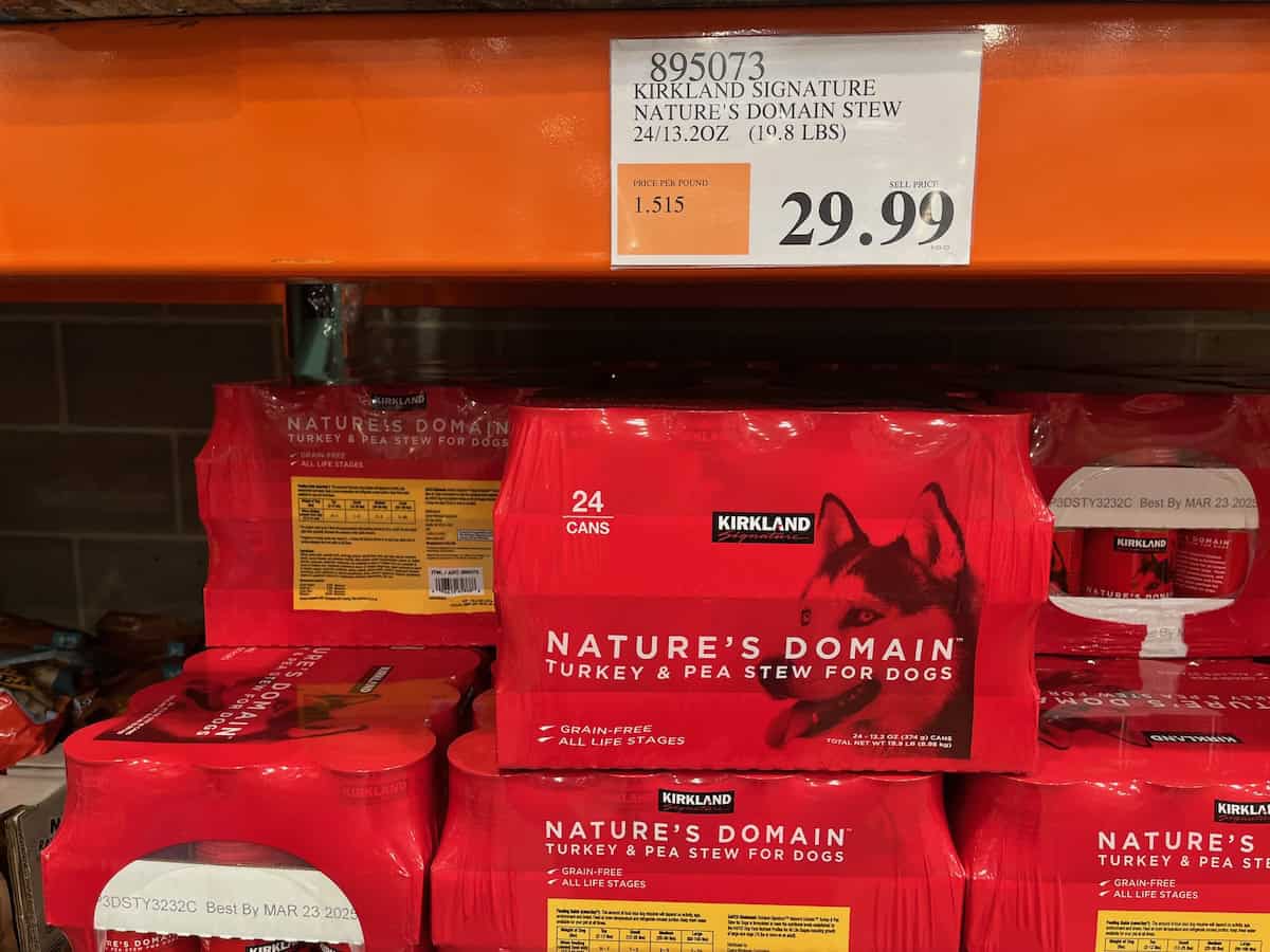 A shelf of Kirkland Signature dog food at Costco.